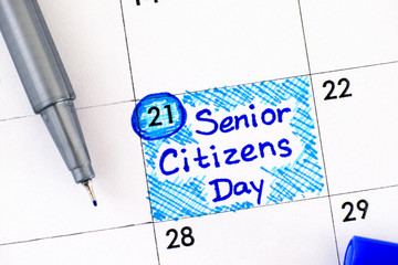 Reminder Senior Citizens Day in calendar with blue pen. August 21st.