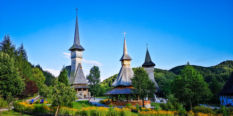 Fototapeta na wymiar BARSANA MONASTERY - AUGUST 16. Unidentified tourists visiting Barsana monastery on August 16, 2019. Maramures area, Romania