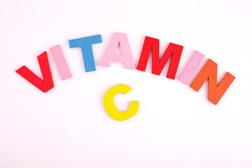 Vitamin C concept with wooden block