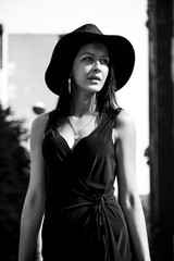 Black haired lady with black hat