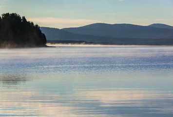 Morning fog above Lake Saggat near to Arrenjarka in Swedish Lapland, Norrbotten County