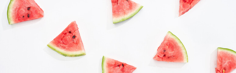 panoramic shot of fresh watermelon slices on white background