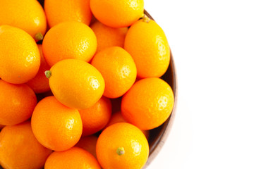 Bowl of Fresh Kumquats Isolated on a White Background