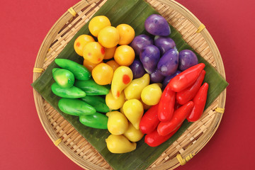 Colourful Luk chup look choop tadeonal Thai desert sweets candy creatve variety bamboo plate banana leaf