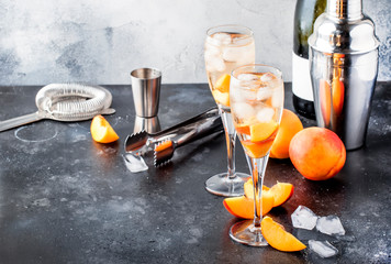 Bellini, alcoholic cocktail with sparkling wine, sugar syrup, lemon juice, peach and ice, gray...