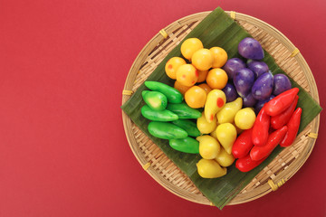 Colourful Luk chup look choop tadeonal Thai desert sweets candy creatve variety bamboo plate banana leaf