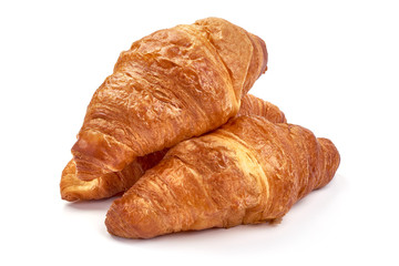 Freshly baked croissants, isolated on white background