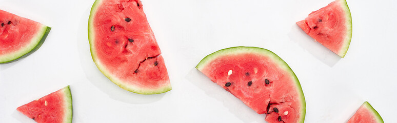 panoramic shot of fresh natural watermelon slices on white background