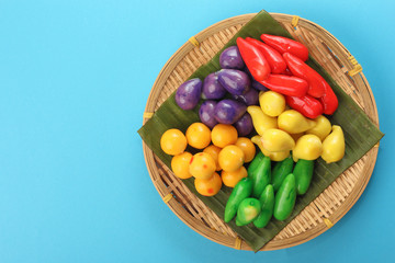 Colourful Luk chup look choop tadeonal Thai desert sweets candy creatve variety bamboo plate banana leaf