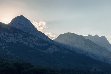 Beautiful landscape in the mountains at sunset. Lovely view of the Taurus Mountains at sunset. Soft sunlight falls on the mountain tops. Kemer, Turkey. Postcard view