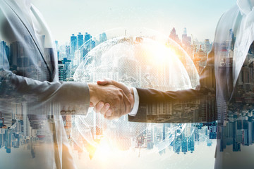 Double exposure Business people of Marketing team with a Partnership greeting power shaking hands,Teamwork Join Hands Partnership Concept after complete deal.