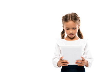 cute schoolkid using digital tablet isolated on white