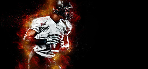 American football player. Sportsman with ball in helmet on stadium in action. Sport wallpaper. Team sports.