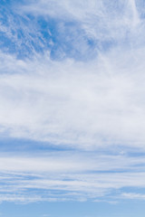 White fluffy clouds in the blue sky in summer