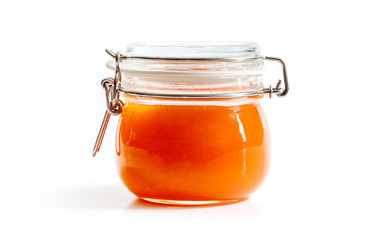 orange homemade jam in transparent glass jar