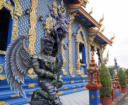 The Blue - Turquiose metalic God statue in Thai blue temple, at the North of Thailand.