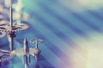 old cogs and gears on blue background