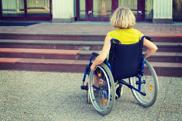 woman on wheelchair and stairs