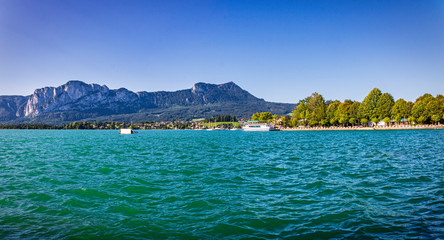 Panoramic view of the Lake Mondsee with mountain range in summer