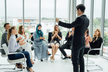 Muslim woman speaks in office.Business, startup, presentation, strategy and people concept - men making presentation to creative team at office.