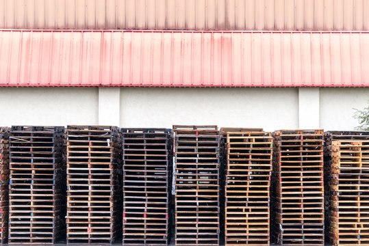 Front view of rusty structures kept outside warehouse