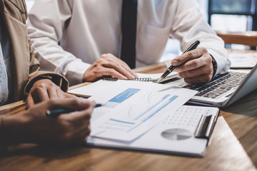 Business team colleague working with new startup project plan and discussion information for financial strategy with laptop, results of their successful teamwork