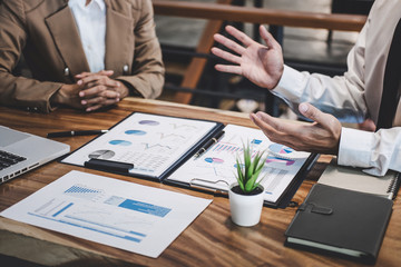 Business team colleague working with new startup project plan and discussion information for financial strategy with laptop, results of their successful teamwork