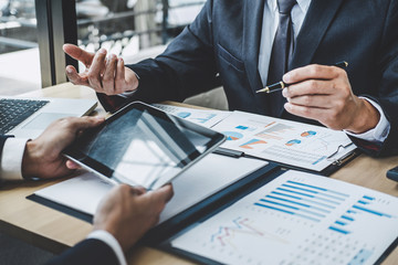 Finance manager meeting discussing company growth project success financial statistics, professional investor working start up project for strategy plan with document, laptop and digital tablet