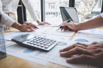 Business casual team manager having a discussion with new project success financial statistics, Partner meeting professional investor working start up project for both company with document