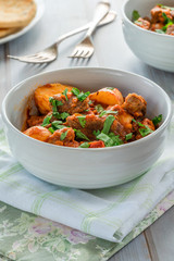 Aloo gosht with naan bread - lamb and potato curry - cuisine popular in Pakistan, Bangladesh and North India