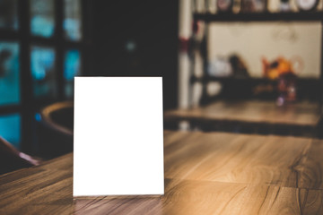 Mock up acrylic frame posters pattern template forms background, blank menu frame on table in coffee shop or restaurant stand for your text of display your product