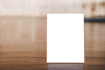 Mock up acrylic frame posters pattern template forms background, blank menu frame on table in coffee shop or restaurant stand for your text of display your product