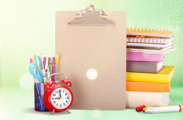 Colorful school supplies on wooden table background