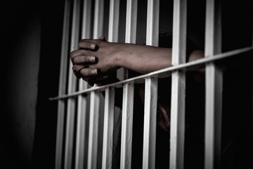 Hands of women desperate to catch the iron prison,prisoner concept,thailand people,Hope to be...