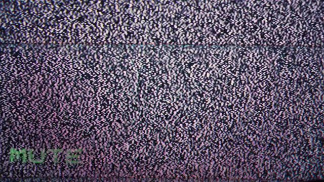The noise on the screen of the old TV. Change the TV volume. Close up