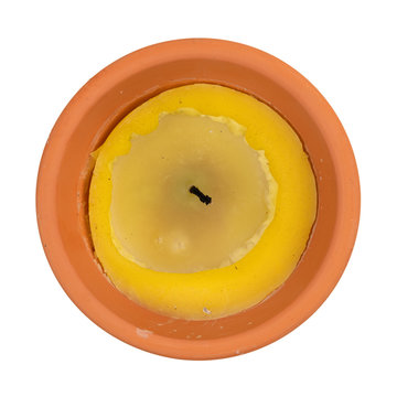 Burned citronella candle on a white background