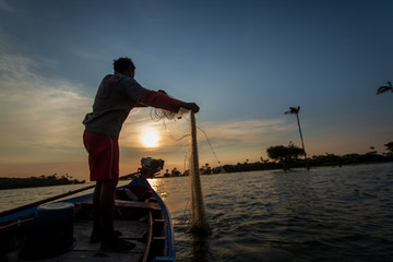 traditional fishermen in indigenous territory and protected area on the Tapajós River, Amazon -...