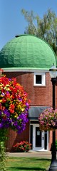 Fototapeta na wymiar Colorful landscape of flower baskets on campus