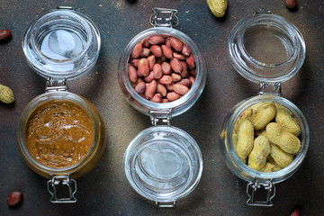 peanut butter in jar and peanuts in a jars