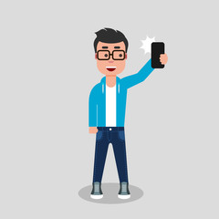A young man is taking a selfie. Boy taking pictures of himself with phone camera.He is standing and smiling in jeans and sweatshirt, holding the phone. Vector stock illustration, flat style, clip art.