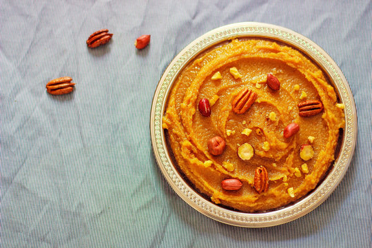 Traditional Azerbaijan,Indian,Turkish sweet dessert halvah with nuts on top