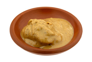 Organic cashew nut butter in a bowl on a white background