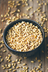 Wheat Grains in bowl and Wheat popcorn in bowl,Wheat Seed rustic background