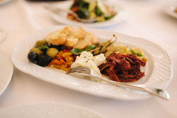 Appetizer in restaurant. Banquet concept. sun-dried tomatoes