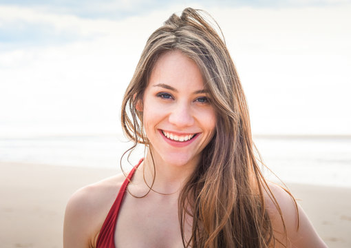 portrait of beautiful young woman on the beach