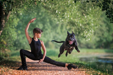 ballet boy and flying black dog