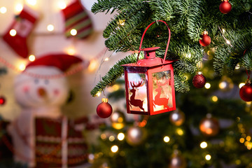 Beautiful decorated christmas tree with lantern. Holiday background