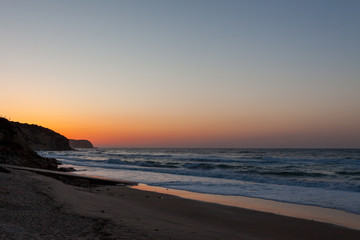 Sunset on beautiful beach at Salema, Portugal