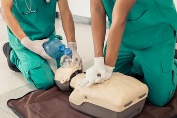 First aid Training by hand. First Aid course in CPR dummy. Concept how to teach skills to help...