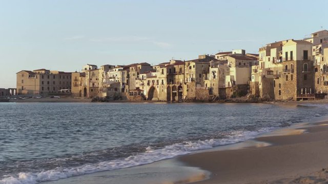 Old coastal houses at beach in Cefalu, Sicily